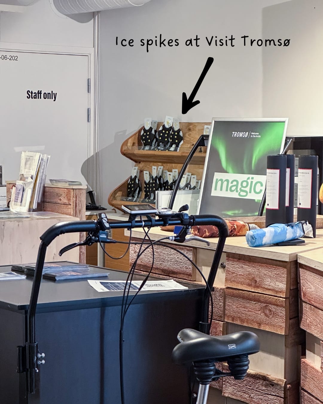 a cluttered office in Tromsø with ice spikes in the background