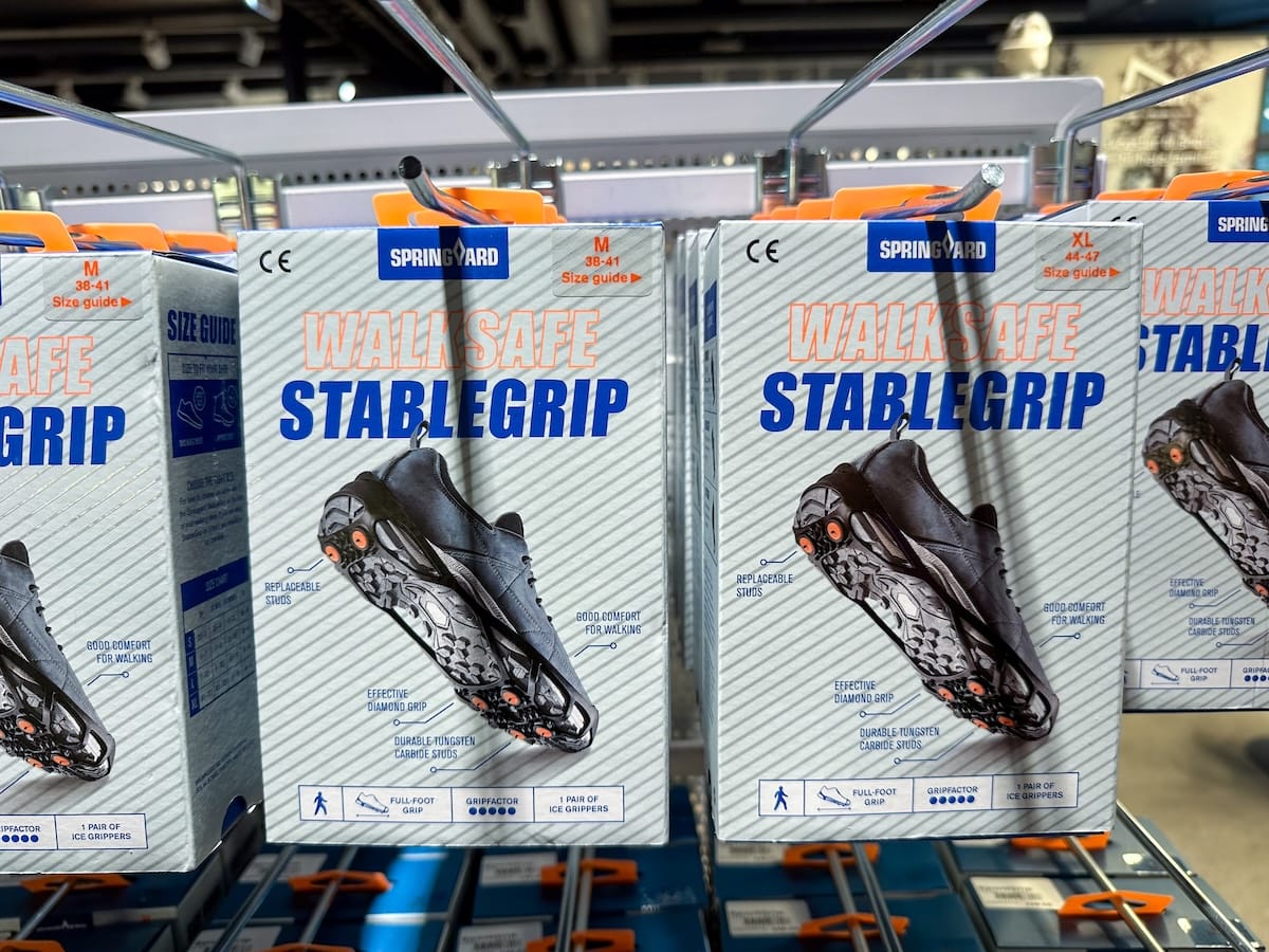 crampons in a box hanging from a display in a shop in norway