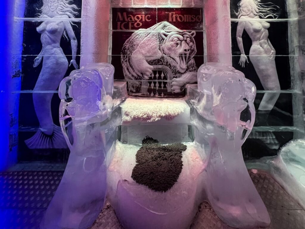 a throne made of ice in an ice bar in Norway